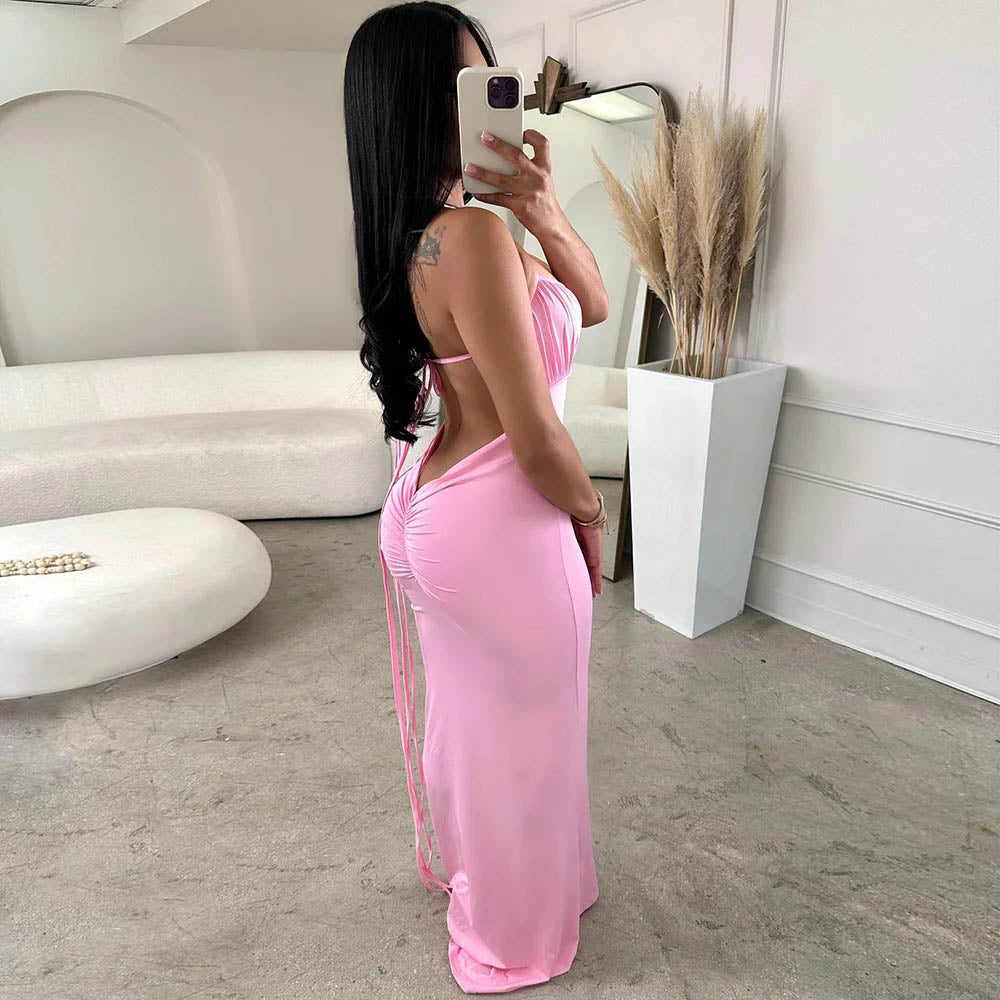 women wearing a pink outfit with v back in a modern room.