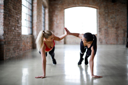 Two women working out at the gym