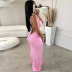 women wearing a pink outfit with v back in a modern room.