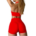 Red sports bra and shorts set on a white background
