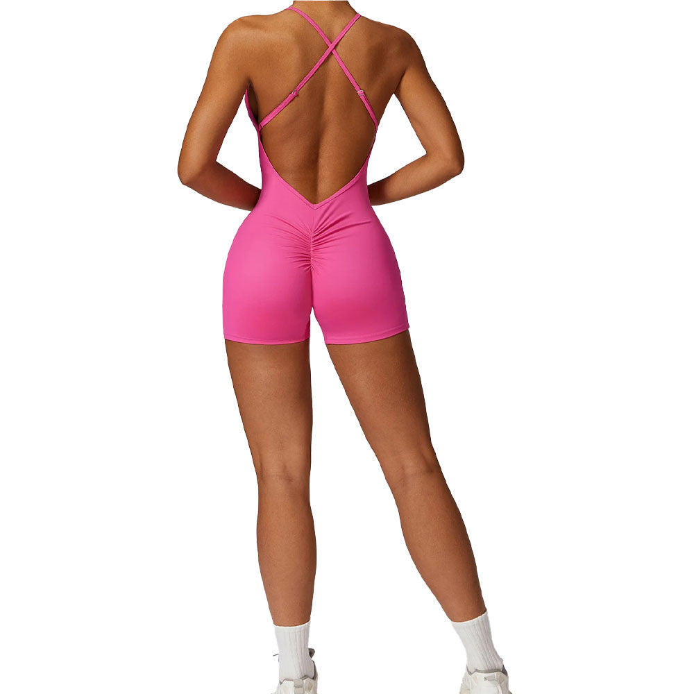 Pink open-back jumpsuit worn by a model on a white background