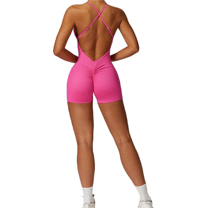 Pink open-back jumpsuit worn by a model on a white background