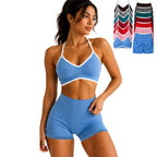 Woman wearing a blue sports bra and shorts set with additional color options displayed.