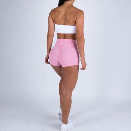 light pink booty scrunch shorts by baller babe gym wear