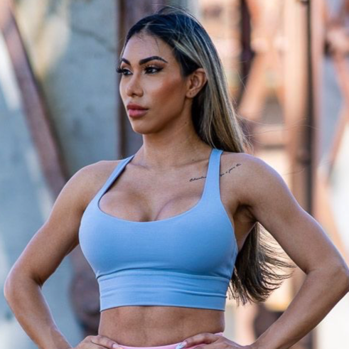 Women in stance with Blue crop top