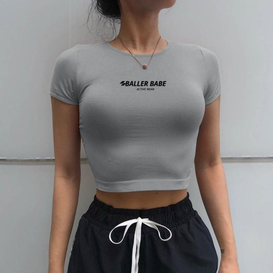 womens grey active wear shirt with baller babe logo on chest